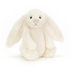 White plush bunny toy on a white background